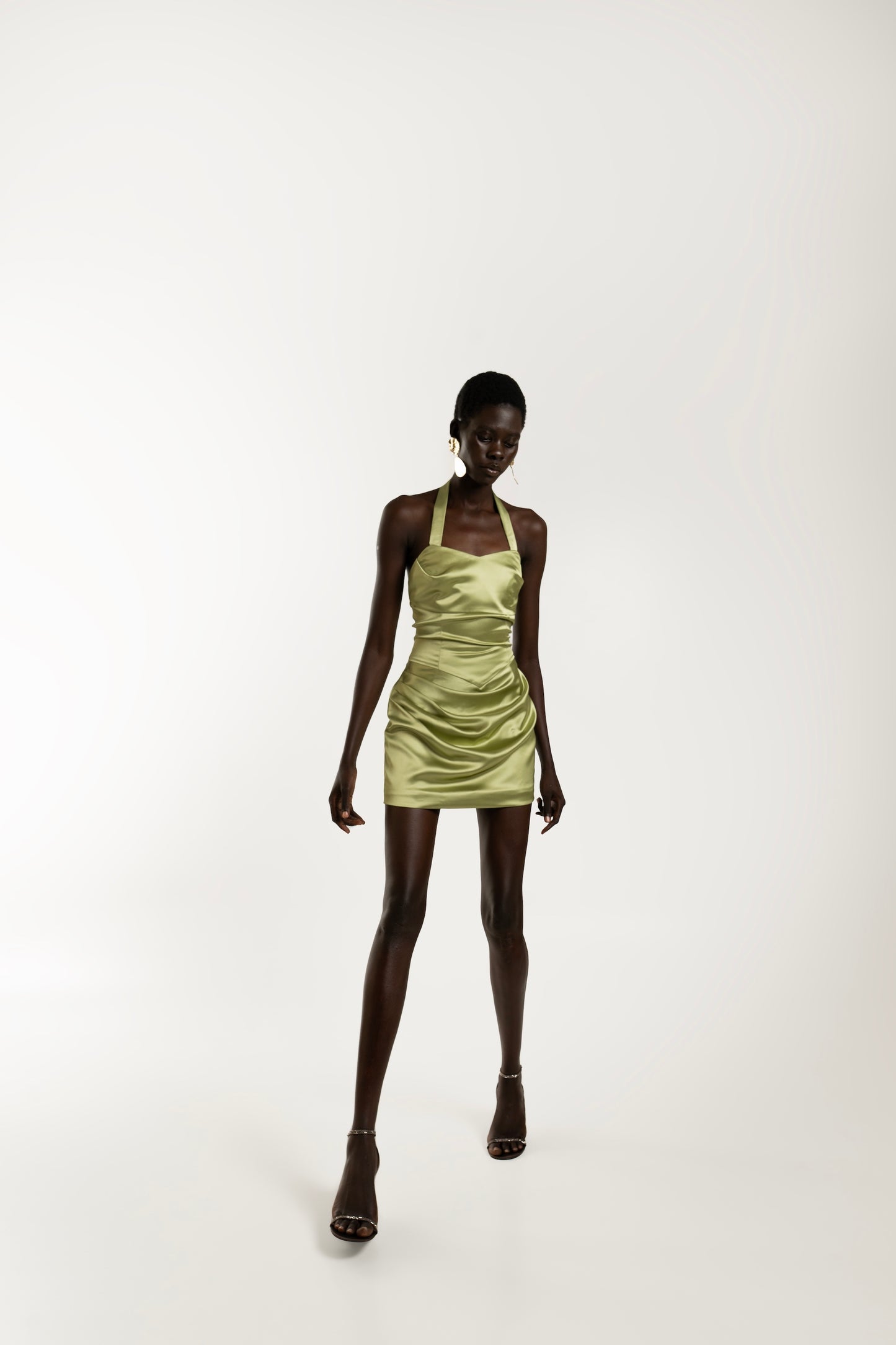 IRA by Irini Charalampous, @irathebrand online shop fashionable ready-to-wear womenswear brand AIME satin elegant
neckline and draped waist mini dress in olive color. Shop online from Cyprus and Greece.