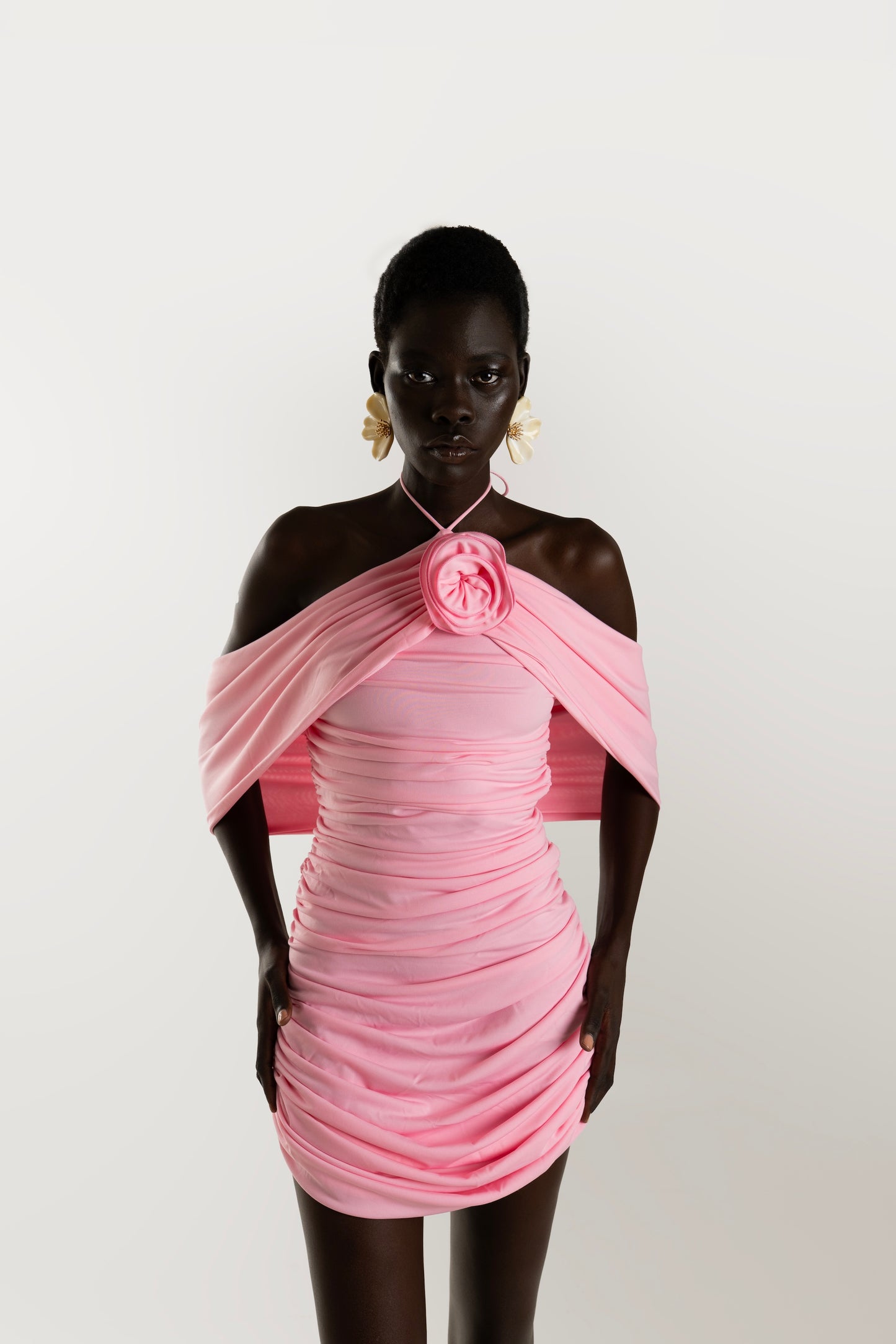 IRA by Irini Charalampous, @irathebrand online shop fashionable ready-to-wear womenswear brand AVA mini dress with ruching and rose at the neck in pink color. Shop online from Cyprus and Greece.