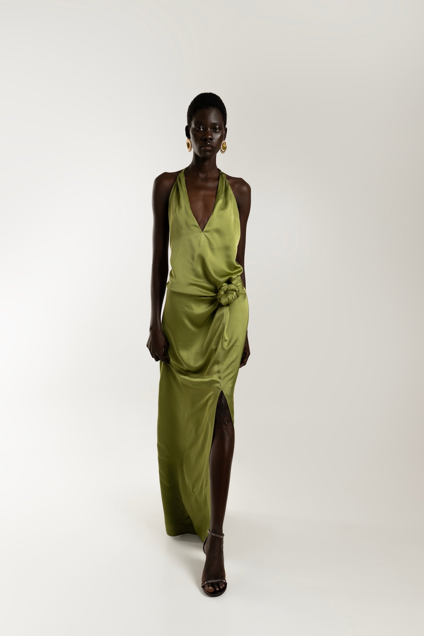 IRA by Irini Charalampous, @irathebrand online shop fashionable ready-to-wear womenswear brand ELIA satin maxi dress with knot detail in khaki green color. Shop online from Cyprus and Greece.