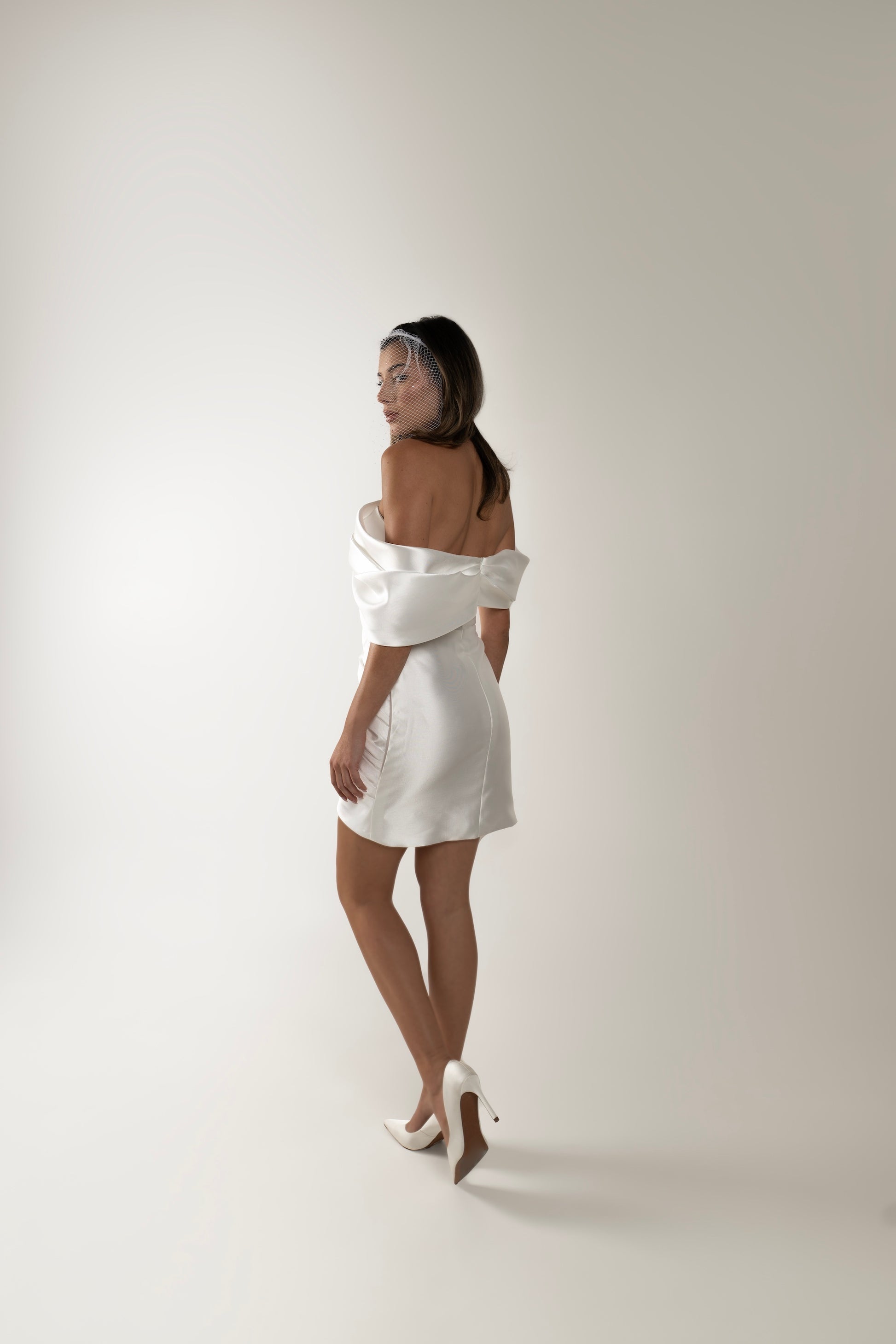 IRA by Irini Charalampous, @irathebrand online shop fashionable ready-to-wear womenswear brand off-shoulder mikado fabric CARA bridal mini dress in white color. Shop online from Cyprus and Greece.