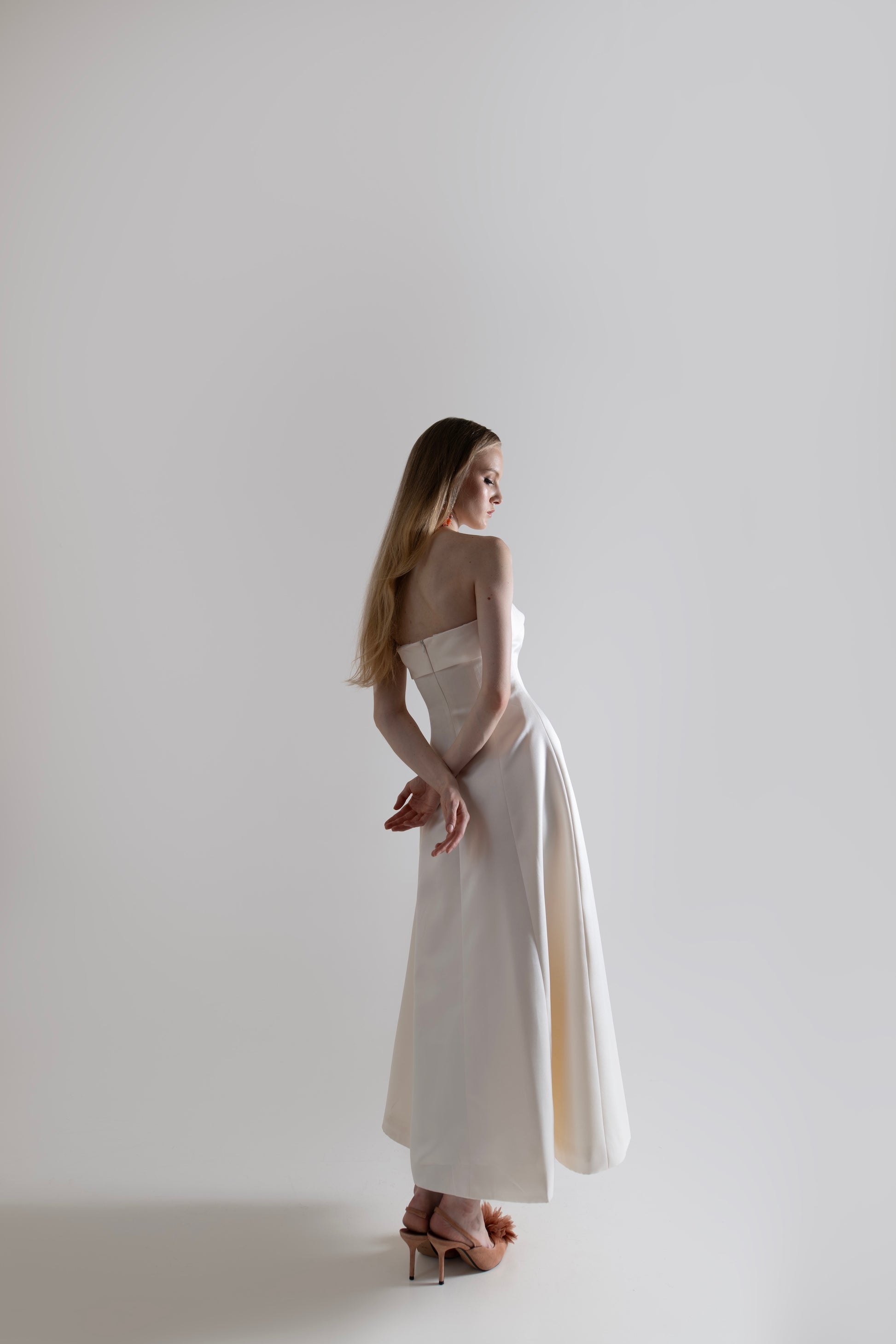 IRA by Irini Charalampous, @irathebrand online shop fashionable ready-to-wear womenswear brand NOOR strapless column gown in off white color. Shop online from Cyprus and Greece.