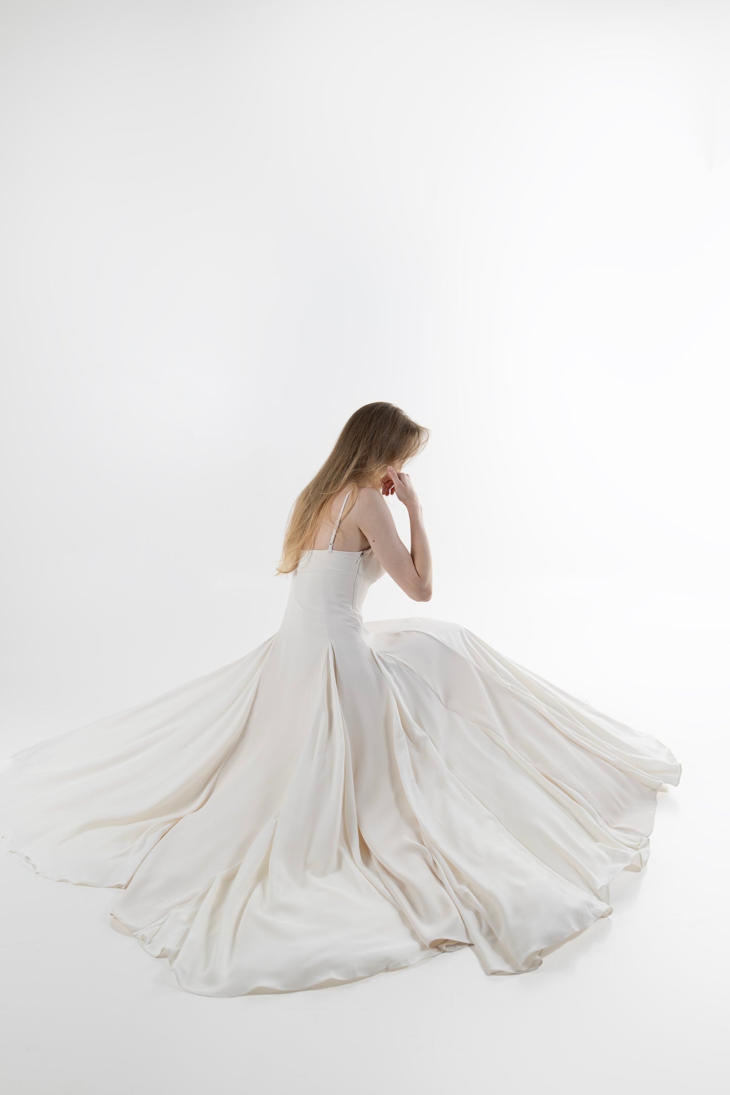 IRA by Irini Charalampous, @irathebrand online shop fashionable ready-to-wear womenswear brand SENA maxi gown with spaghetti straps flowing skirt and structured bodice in off white color. Shop online from Cyprus and Greece.