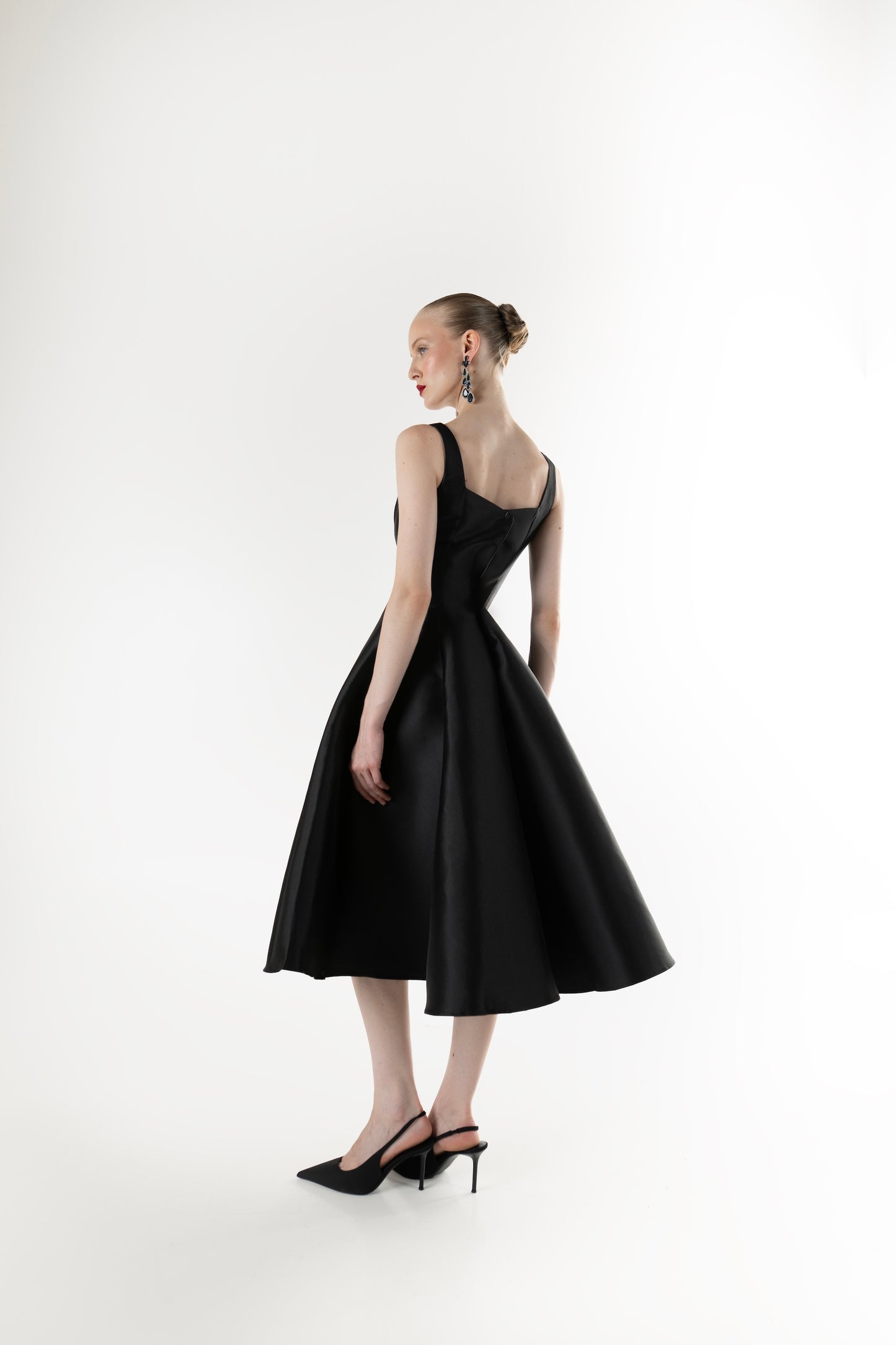 IRA by Irini Charalampous, @irathebrand online shop fashionable ready-to-wear womenswear brand NINA sleeveless midi dress with square neckline featuring a sculpted bodice and circle full skirt in black color. Shop online from Cyprus and Greece.