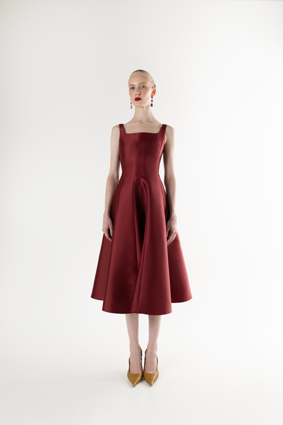 IRA by Irini Charalampous, @irathebrand online shop fashionable ready-to-wear womenswear brand NINA sleeveless midi dress with square neckline featuring a sculpted bodice and circle full skirt in burgundy color. Shop online from Cyprus and Greece.
