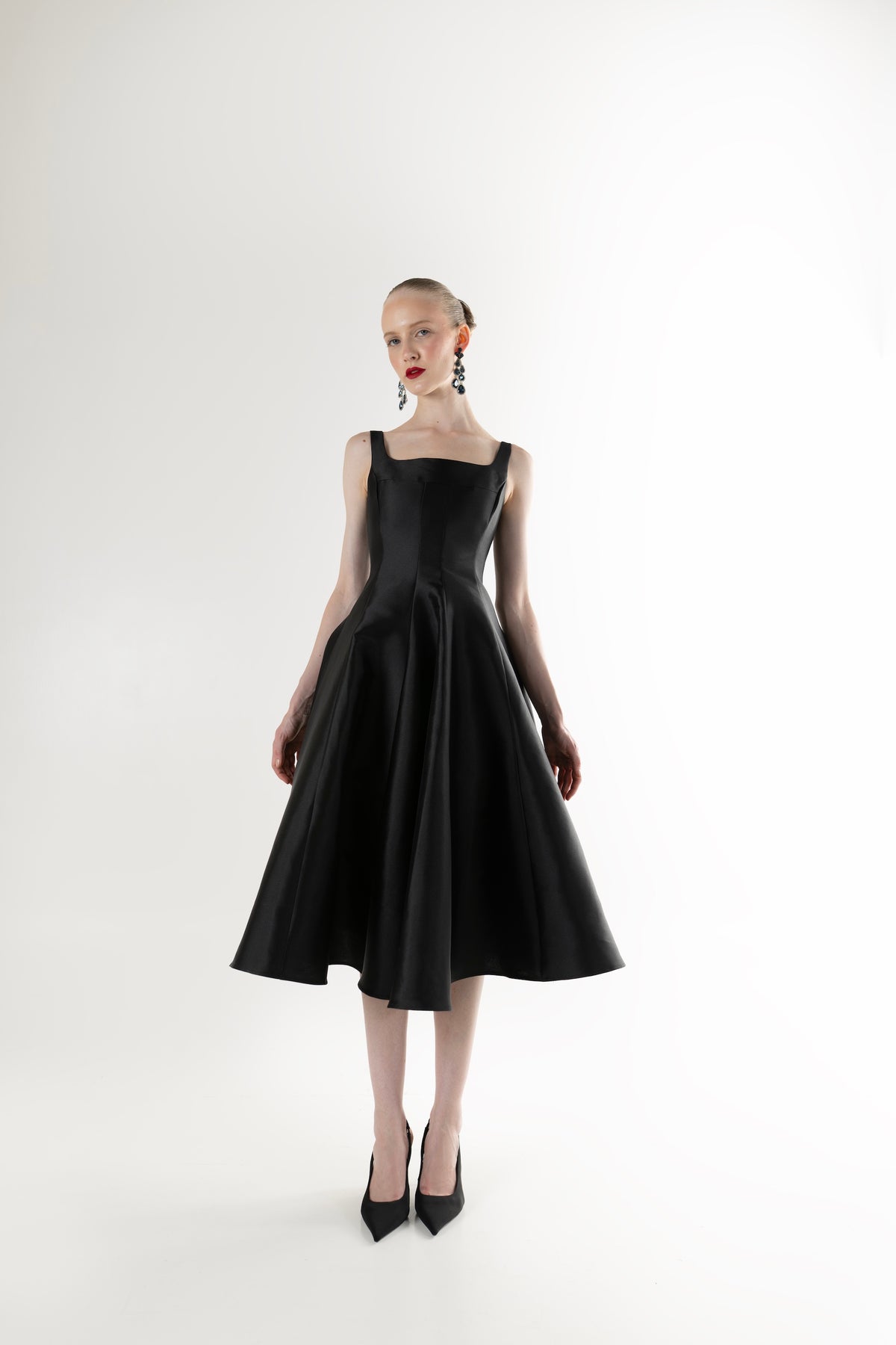 IRA by Irini Charalampous, @irathebrand online shop fashionable ready-to-wear womenswear brand NINA sleeveless midi dress with square neckline featuring a sculpted bodice and circle full skirt in black color. Shop online from Cyprus and Greece.