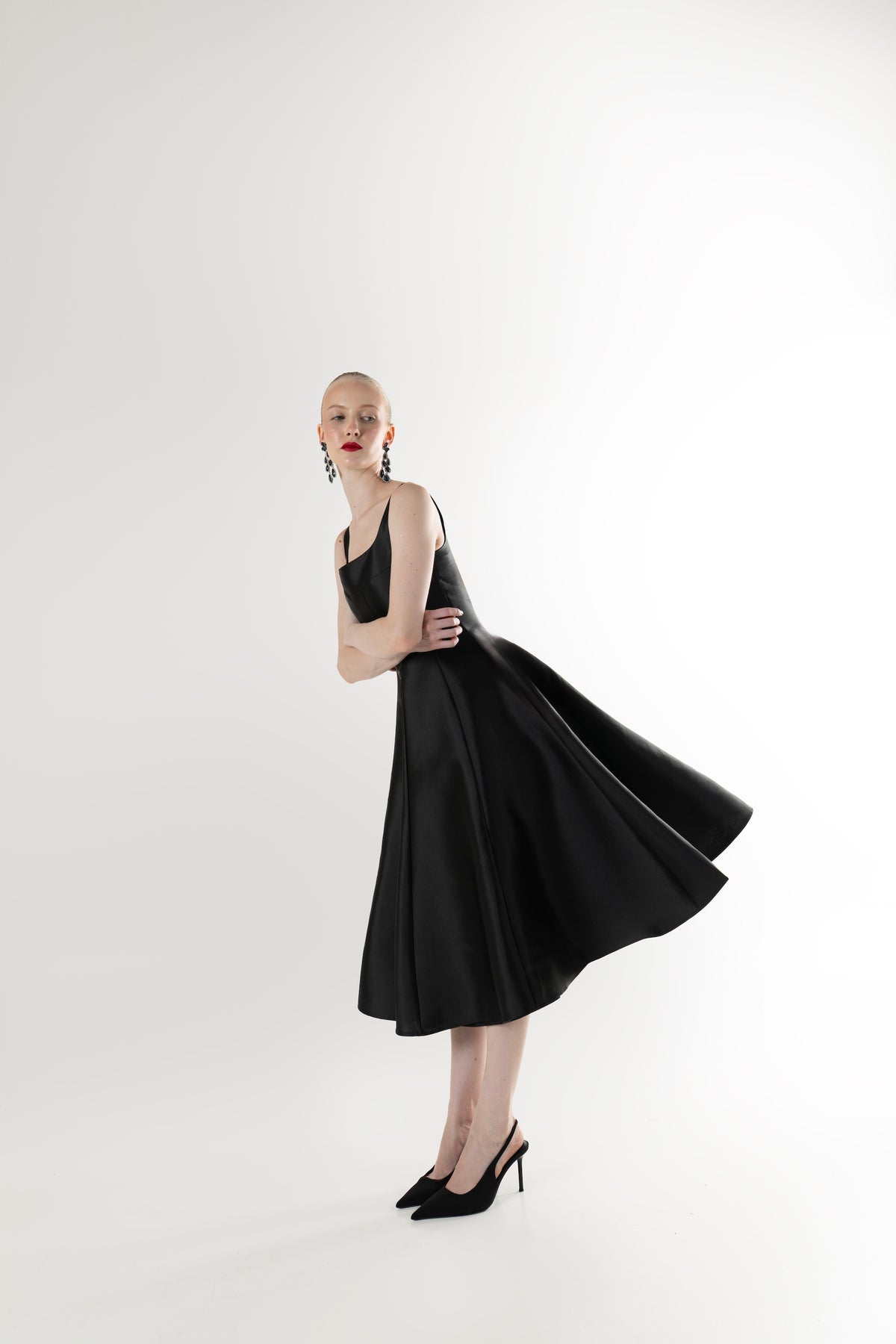 IRA by Irini Charalampous, @irathebrand online shop fashionable ready-to-wear womenswear brand NINA sleeveless midi dress with square neckline featuring a sculpted bodice and circle full skirt in black color. Shop online from Cyprus and Greece.