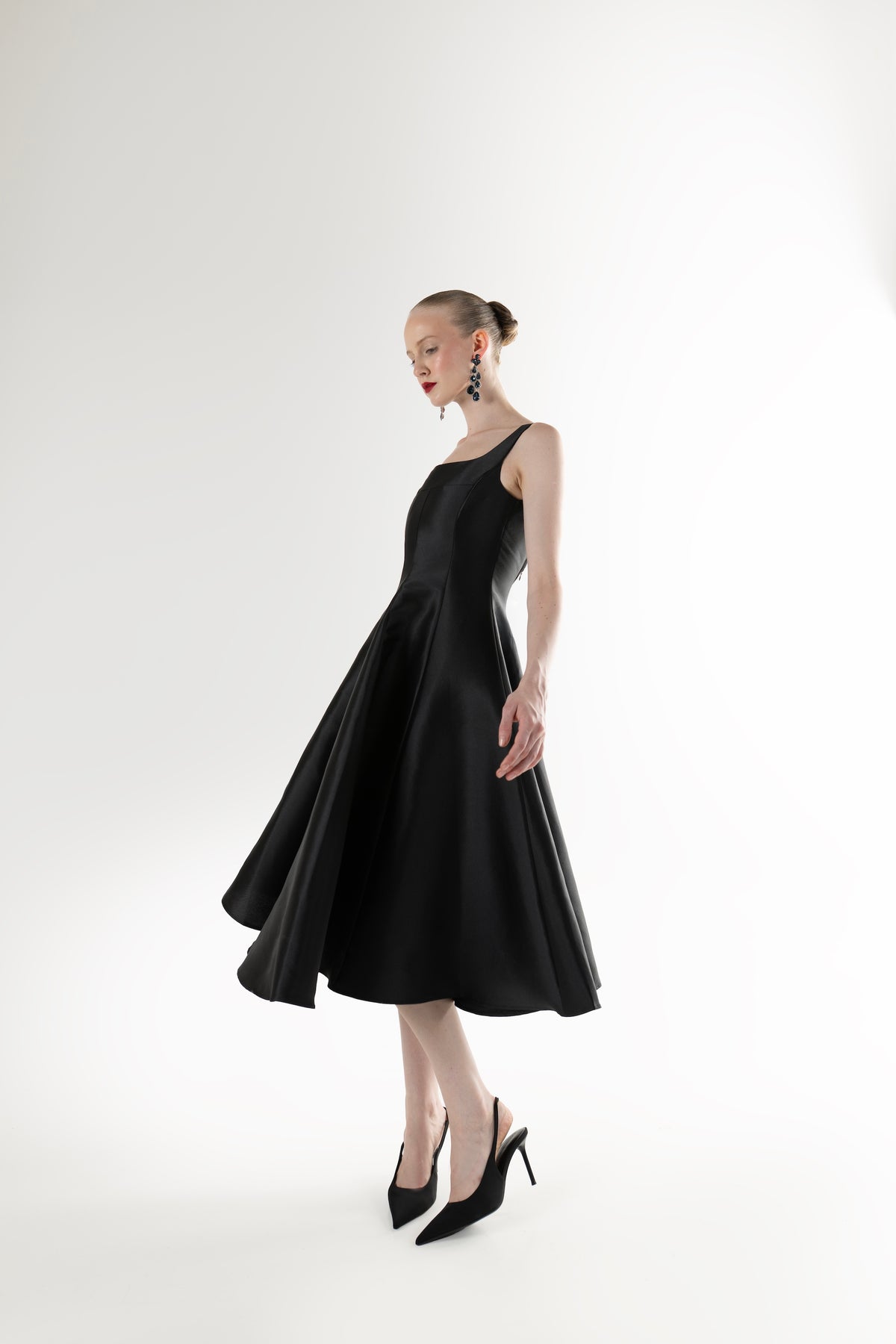 IRA by Irini Charalampous, @irathebrand online shop fashionable ready-to-wear womenswear brand NINA sleeveless midi dress with square neckline featuring a sculpted bodice and circle full skirt in black color. Shop online from Cyprus and Greece.