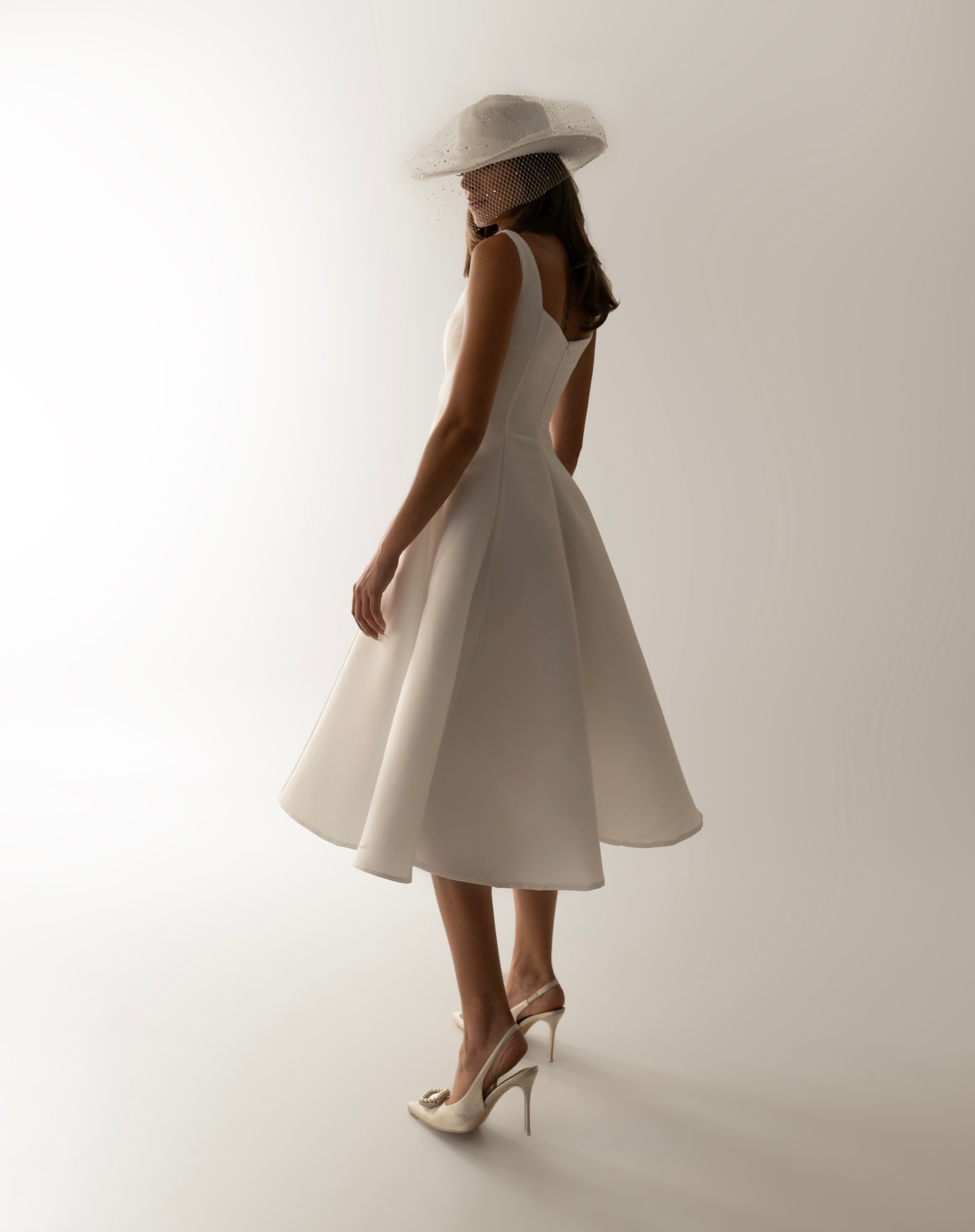 IRA by Irini Charalampous, @irathebrand online shop fashionable ready-to-wear womenswear brand sculpted bust scuba fabric NINA bridal midi dress in white color. Shop online from Cyprus and Greece.