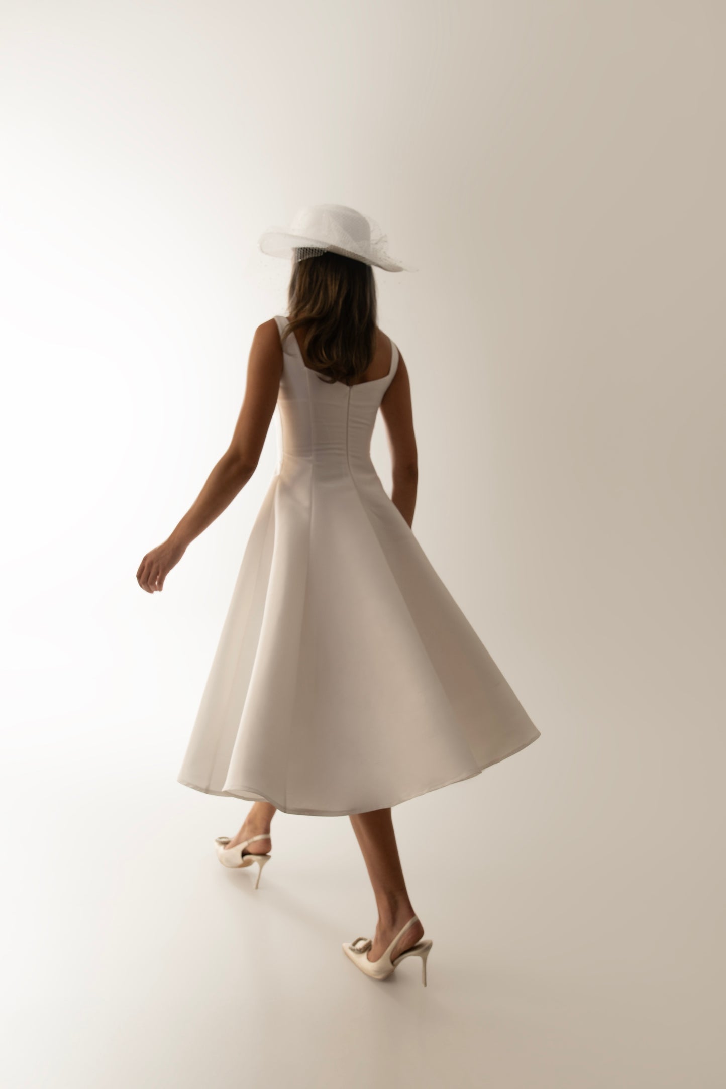 IRA by Irini Charalampous, @irathebrand online shop fashionable ready-to-wear womenswear brand sculpted bust scuba fabric NINA bridal midi dress with circle skirt in white color. Shop online from Cyprus and Greece.