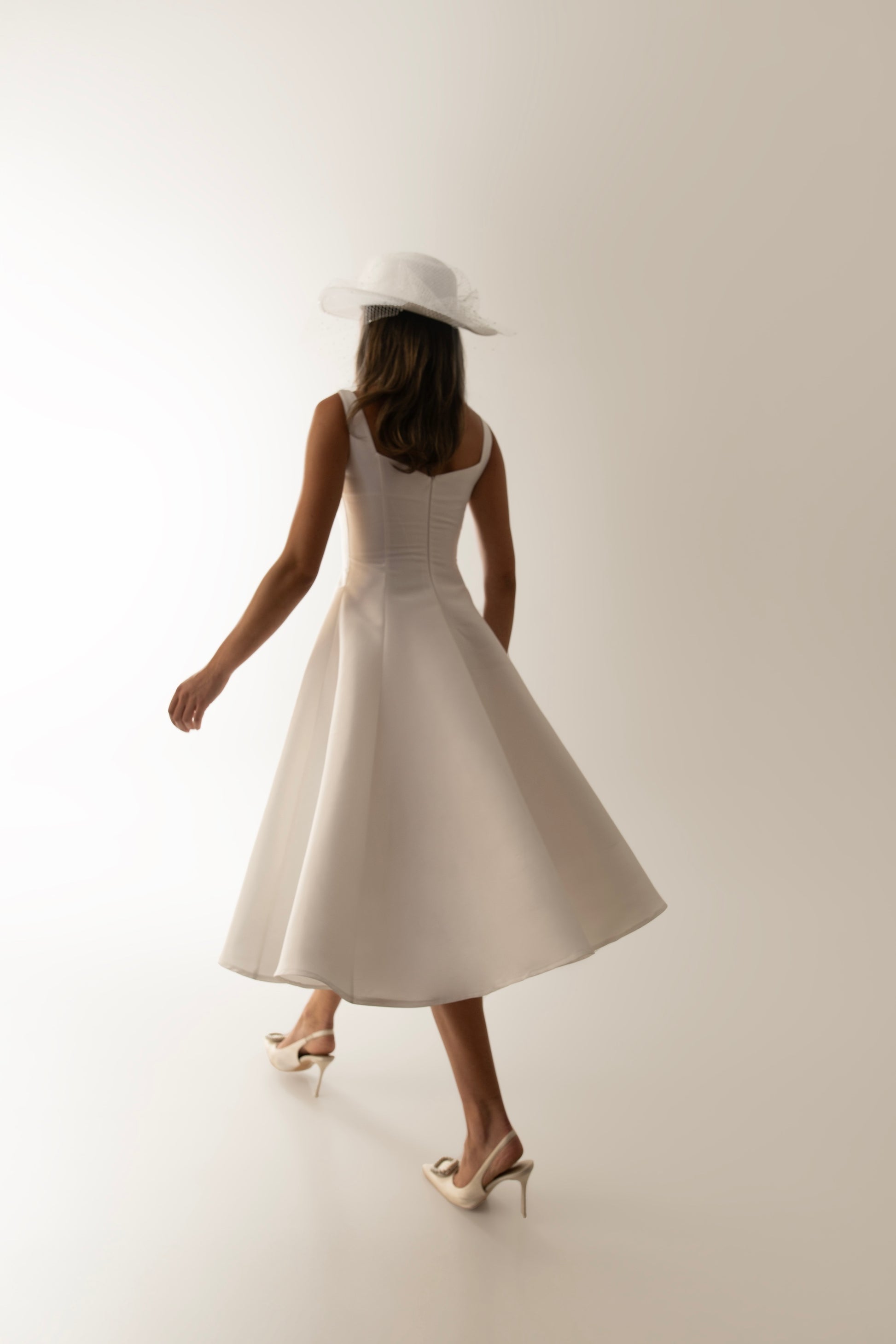 IRA by Irini Charalampous, @irathebrand online shop fashionable ready-to-wear womenswear brand sculpted bust scuba fabric NINA bridal midi dress with circle skirt in white color. Shop online from Cyprus and Greece.
