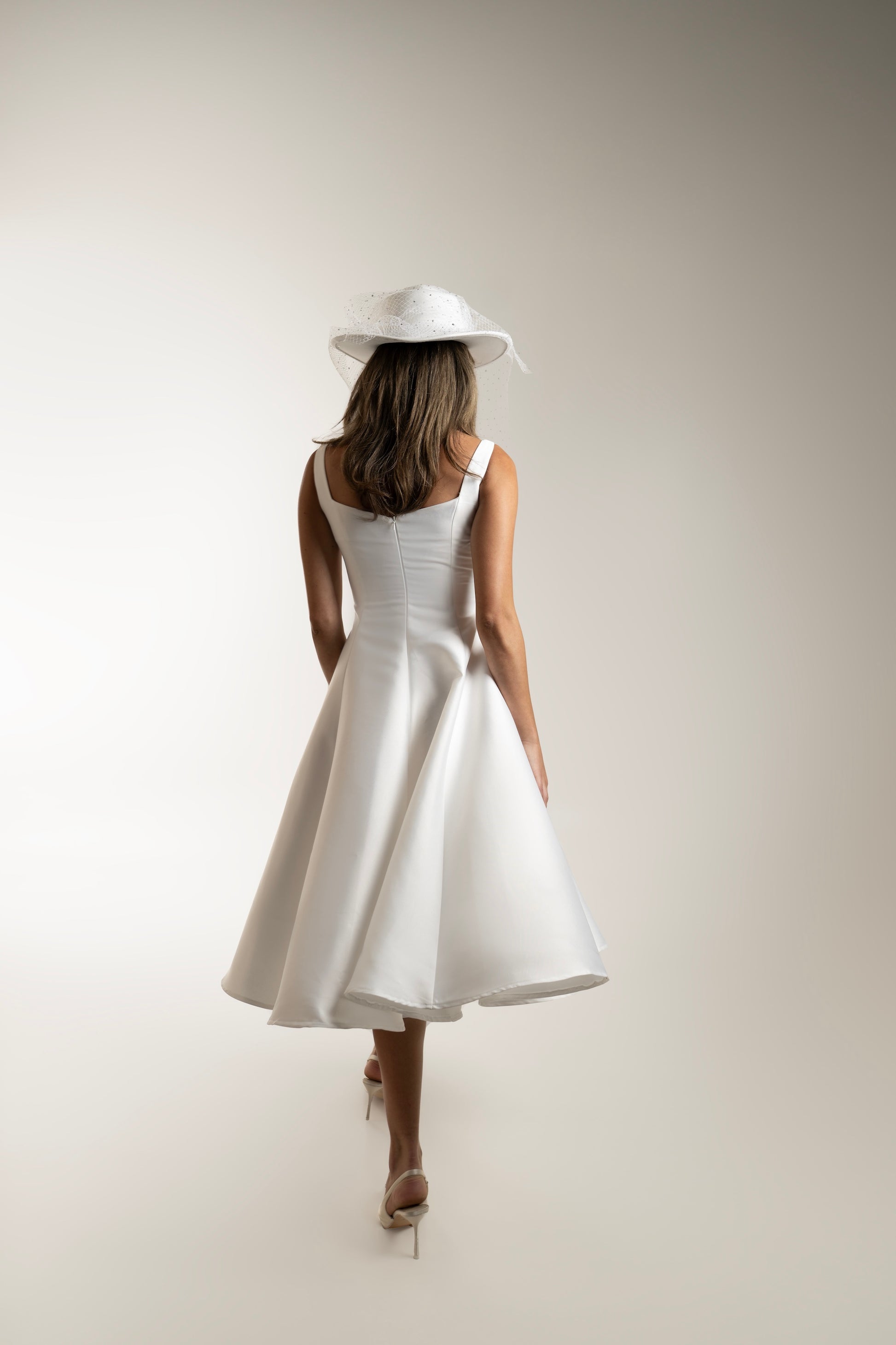 IRA by Irini Charalampous, @irathebrand online shop fashionable ready-to-wear womenswear brand sculpted bust scuba fabric NINA bridal midi dress with circle skirt in white color. Shop online from Cyprus and Greece.