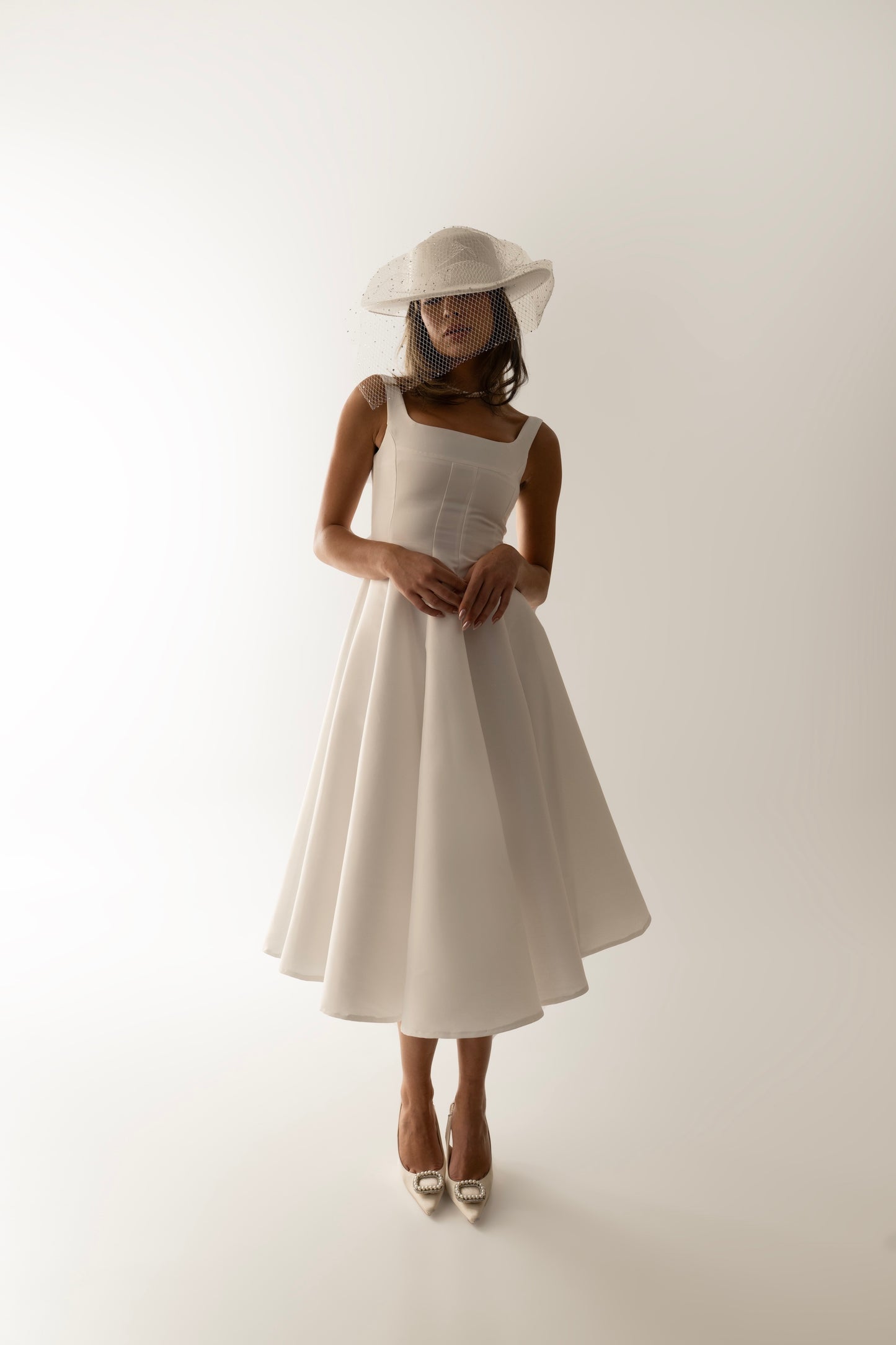 IRA by Irini Charalampous, @irathebrand online shop fashionable ready-to-wear womenswear brand sculpted bust scuba fabric NINA bridal midi dress with circle skirt in white color. Shop online from Cyprus and Greece.
