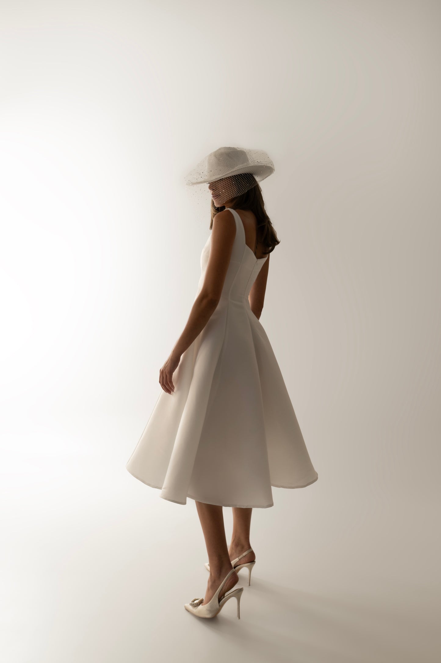 IRA by Irini Charalampous, @irathebrand online shop fashionable ready-to-wear womenswear brand sculpted bust scuba fabric NINA bridal midi dress with circle skirt in white color. Shop online from Cyprus and Greece.