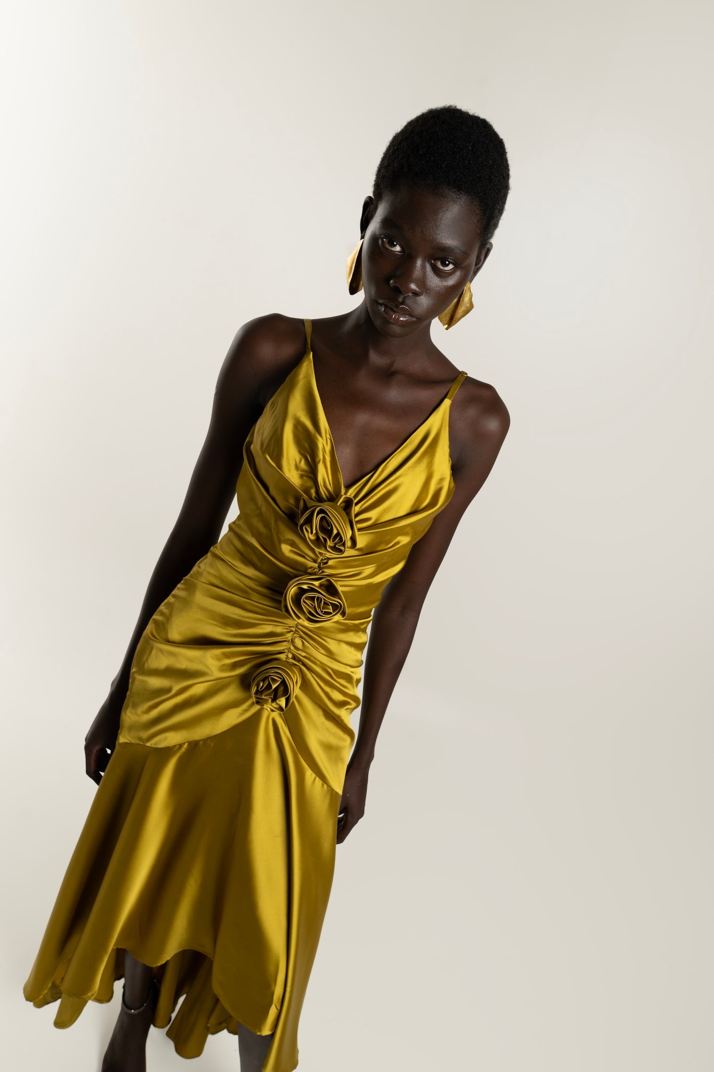 IRA by Irini Charalampous, @irathebrand online shop fashionable ready-to-wear womenswear brand CORA satin plunging neckline with ruching at the waist and roses maxi dress in ochre color. Shop online from Cyprus and Greece.