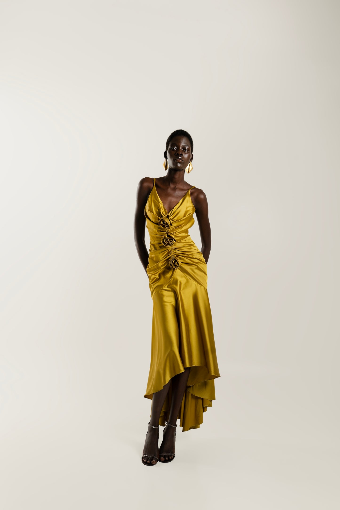 IRA by Irini Charalampous, @irathebrand online shop fashionable ready-to-wear womenswear brand CORA satin plunging neckline with ruching at the waist and roses maxi dress in ochre color. Shop online from Cyprus and Greece.