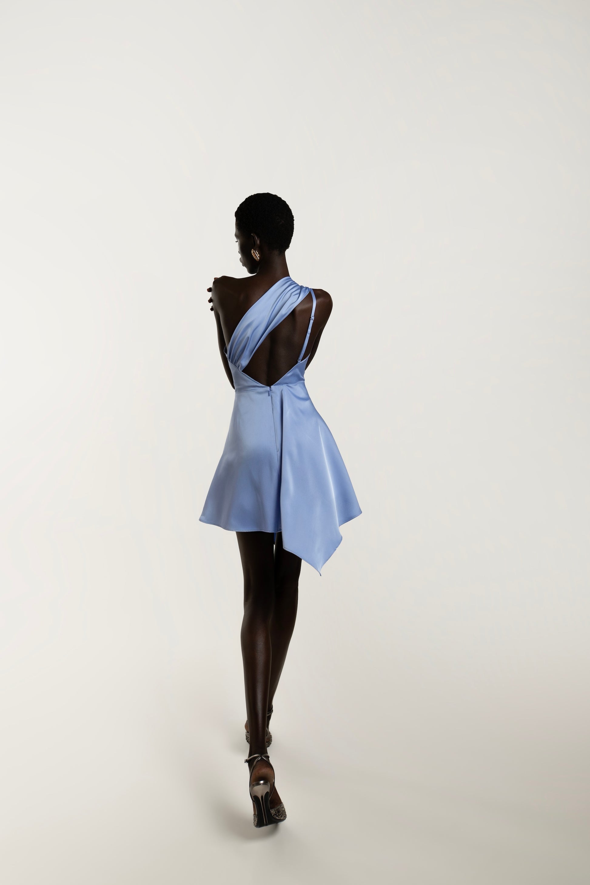 IRA by Irini Charalampous, @irathebrand online shop fashionable ready-to-wear womenswear brand LINA satin asymmetric one shoulder mini dress in light blue color. Shop online from Cyprus and Greece.