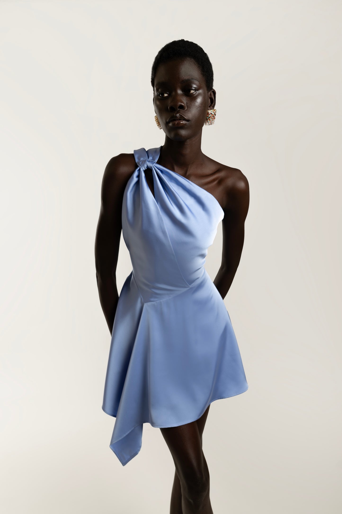 IRA by Irini Charalampous, @irathebrand online shop fashionable ready-to-wear womenswear brand LINA satin asymmetric one shoulder mini dress in light blue color. Shop online from Cyprus and Greece.