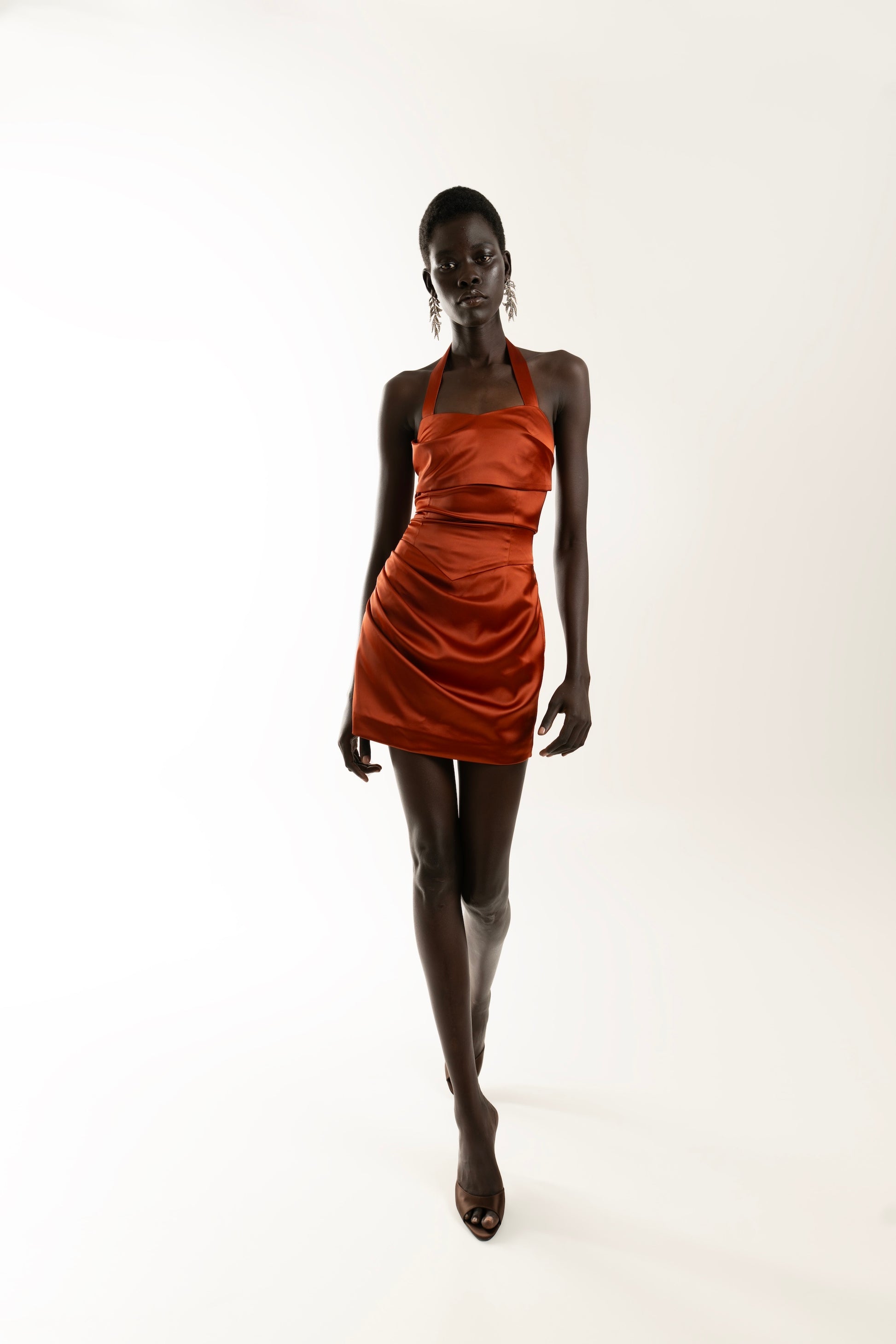 IRA by Irini Charalampous, @irathebrand online shop fashionable ready-to-wear womenswear brand AIME satin elegant
neckline and draped waist mini dress in bronze color. Shop online from Cyprus and Greece.