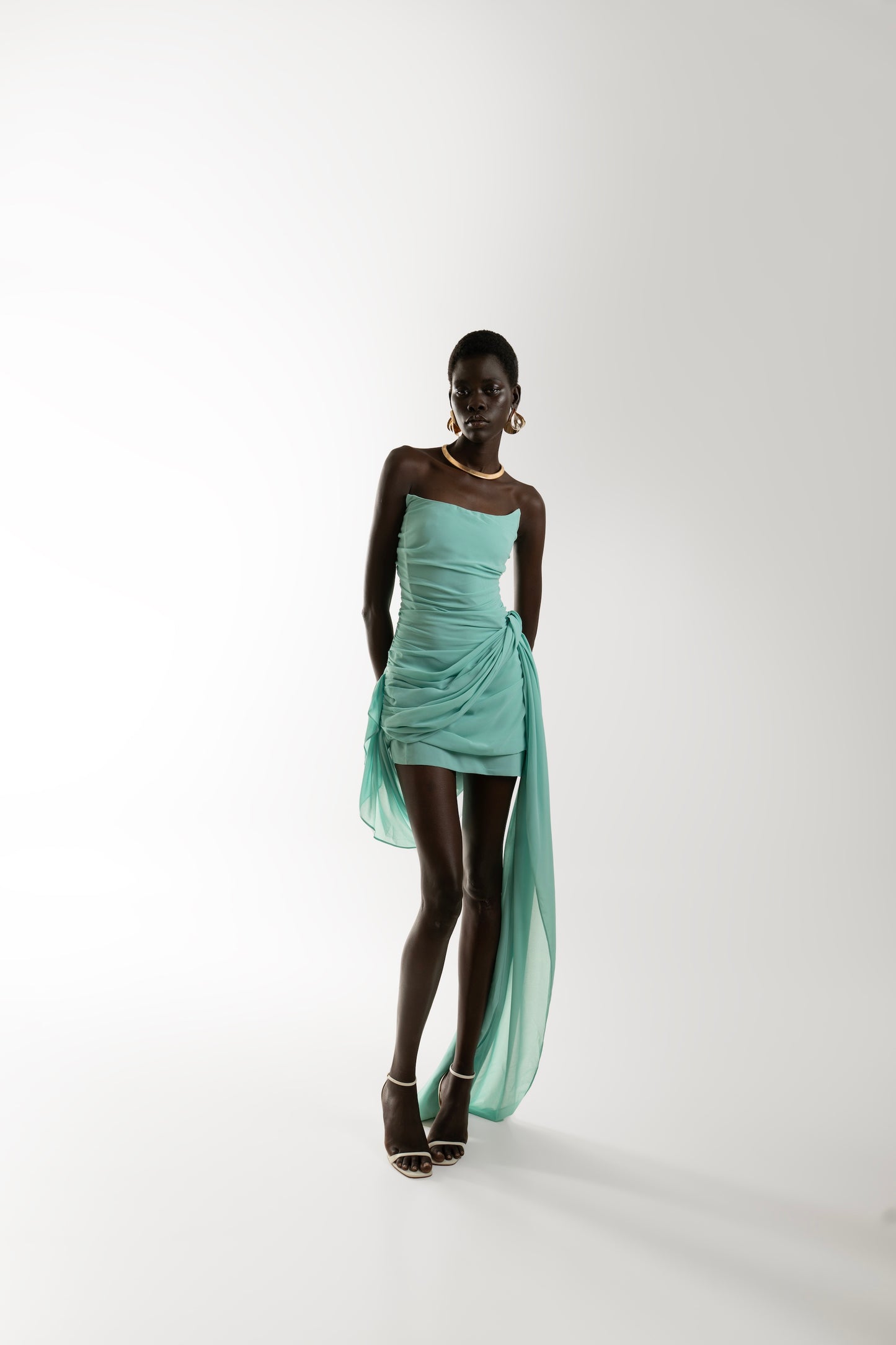 IRA by Irini Charalampous, @irathebrand online shop fashionable ready-to-wear womenswear brand TALA strapless mini dress with train in turquoise color. Shop online from Cyprus and Greece.