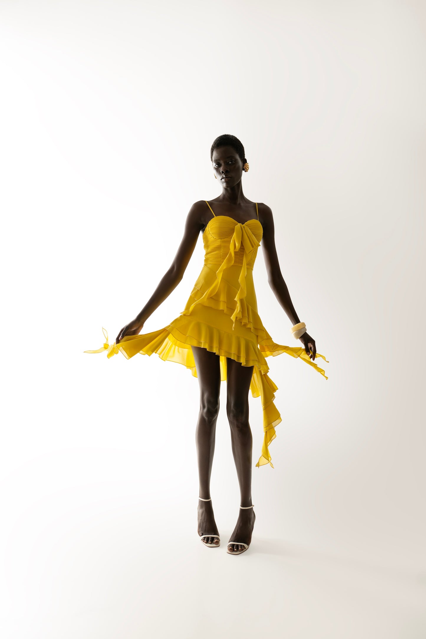 IRA by Irini Charalampous, @irathebrand online shop fashionable ready-to-wear womenswear brand NARA mini dress with hanging fringes and ruffles in yellow color. Shop online from Cyprus and Greece.