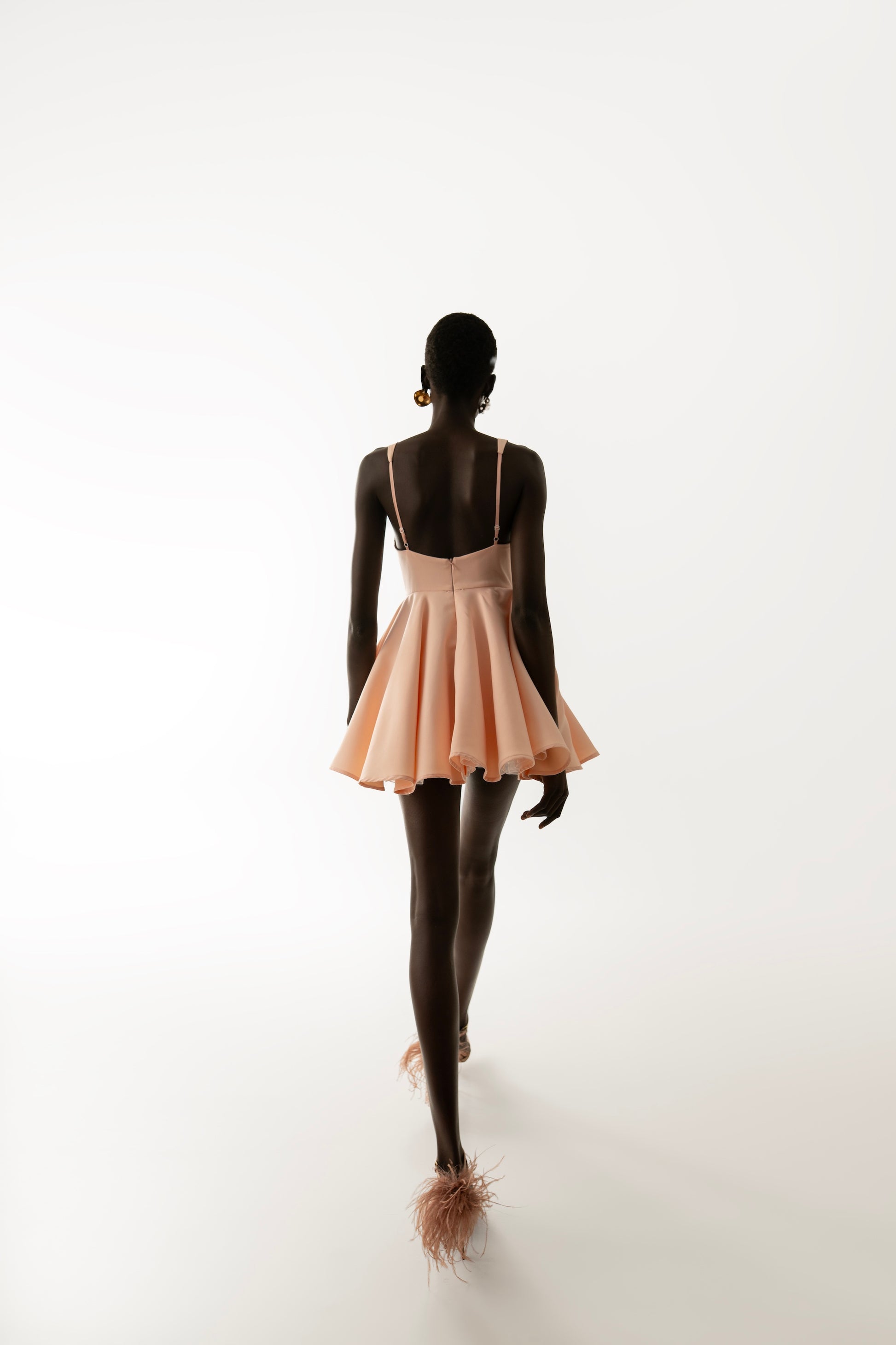 IRA by Irini Charalampous, @irathebrand online shop fashionable ready-to-wear womenswear brand RINA scuba mini dress sculpted bust with short circle skirt in nude pink color. Shop online from Cyprus and Greece.