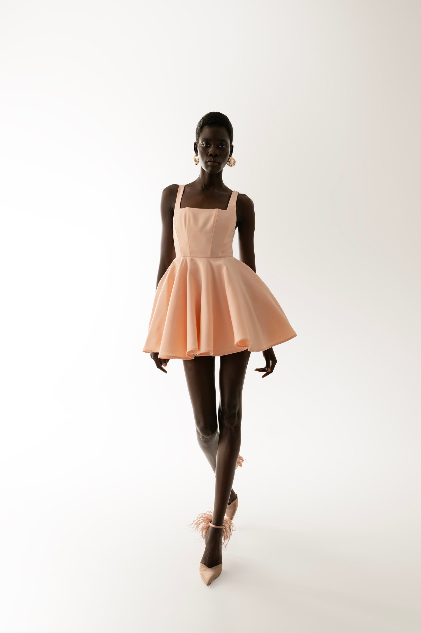 IRA by Irini Charalampous, @irathebrand online shop fashionable ready-to-wear womenswear brand RINA scuba mini dress sculpted bust with short circle skirt in nude pink color. Shop online from Cyprus and Greece.