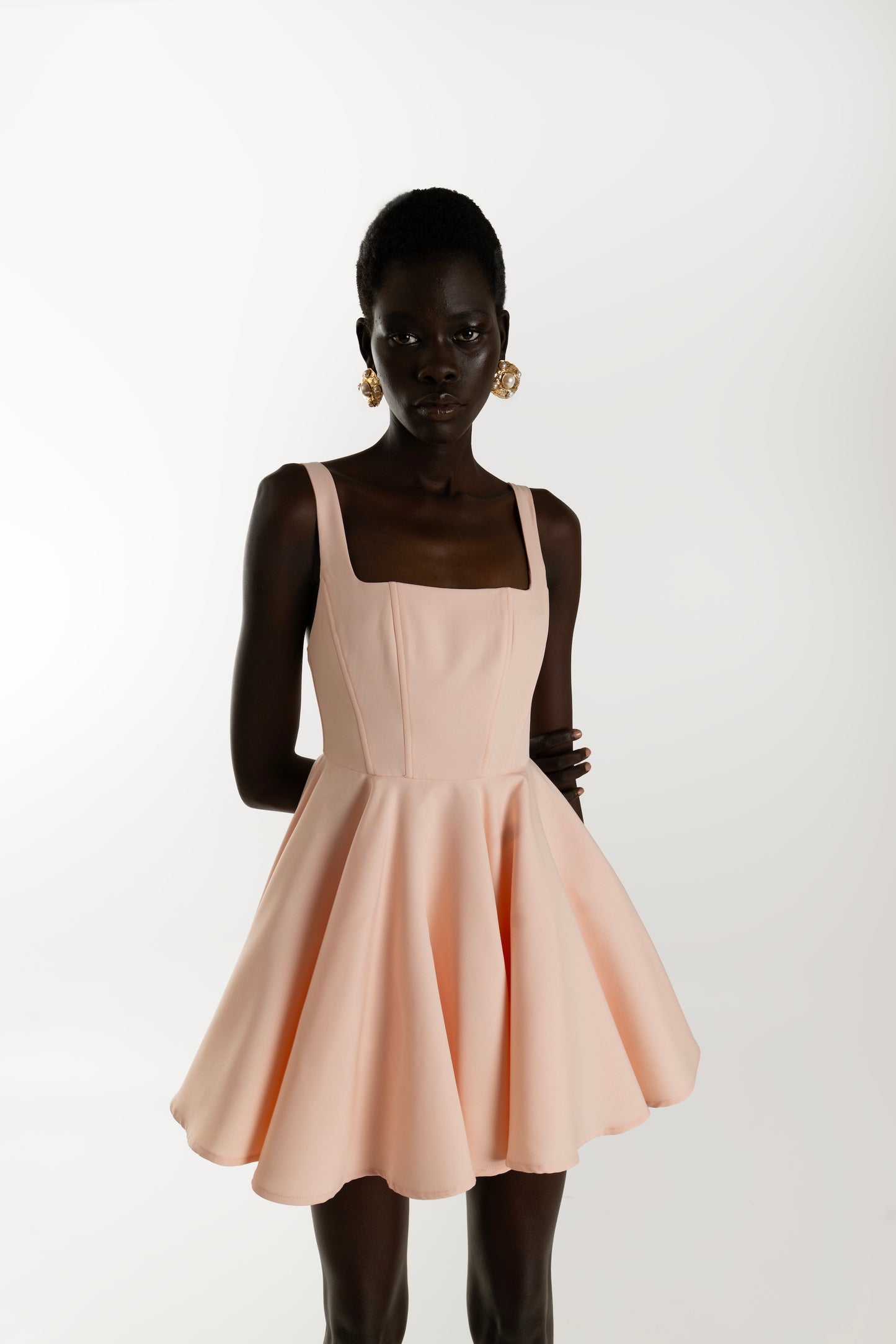 IRA by Irini Charalampous, @irathebrand online shop fashionable ready-to-wear womenswear brand RINA scuba mini dress sculpted bust with short circle skirt in nude pink color. Shop online from Cyprus and Greece.