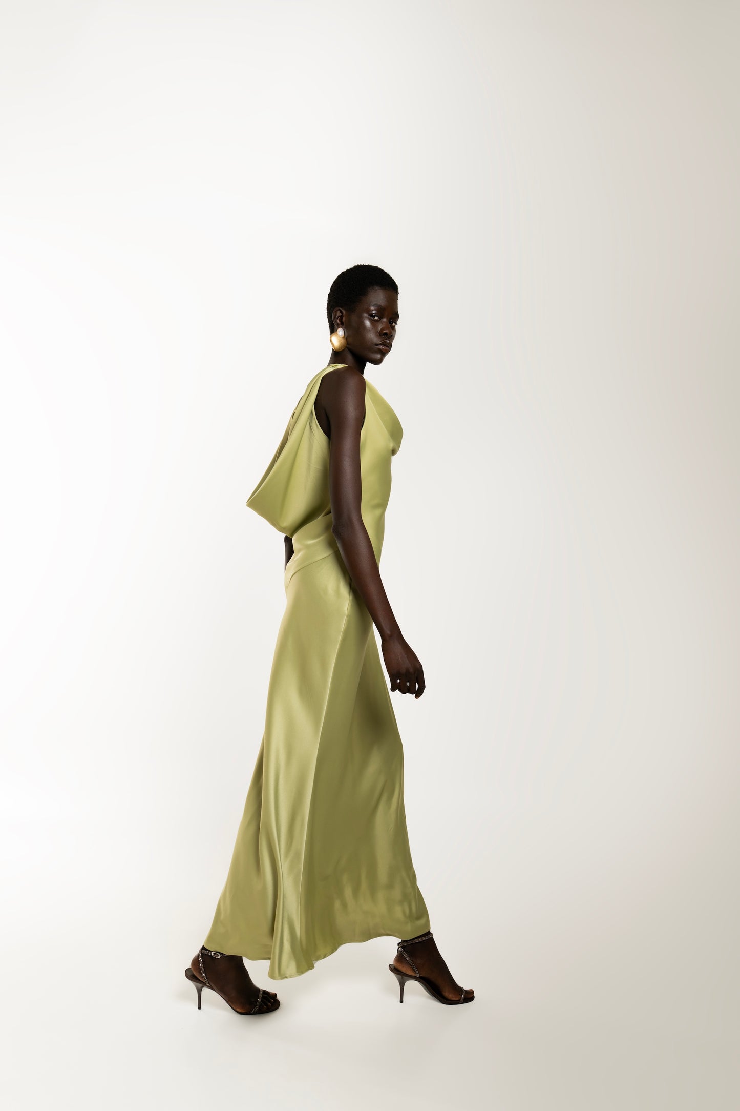 IRA by Irini Charalampous, @irathebrand online shop fashionable ready-to-wear womenswear brand KAIA satin basic maxi dress with open back and tie detail in olive green color. Shop online from Cyprus and Greece.