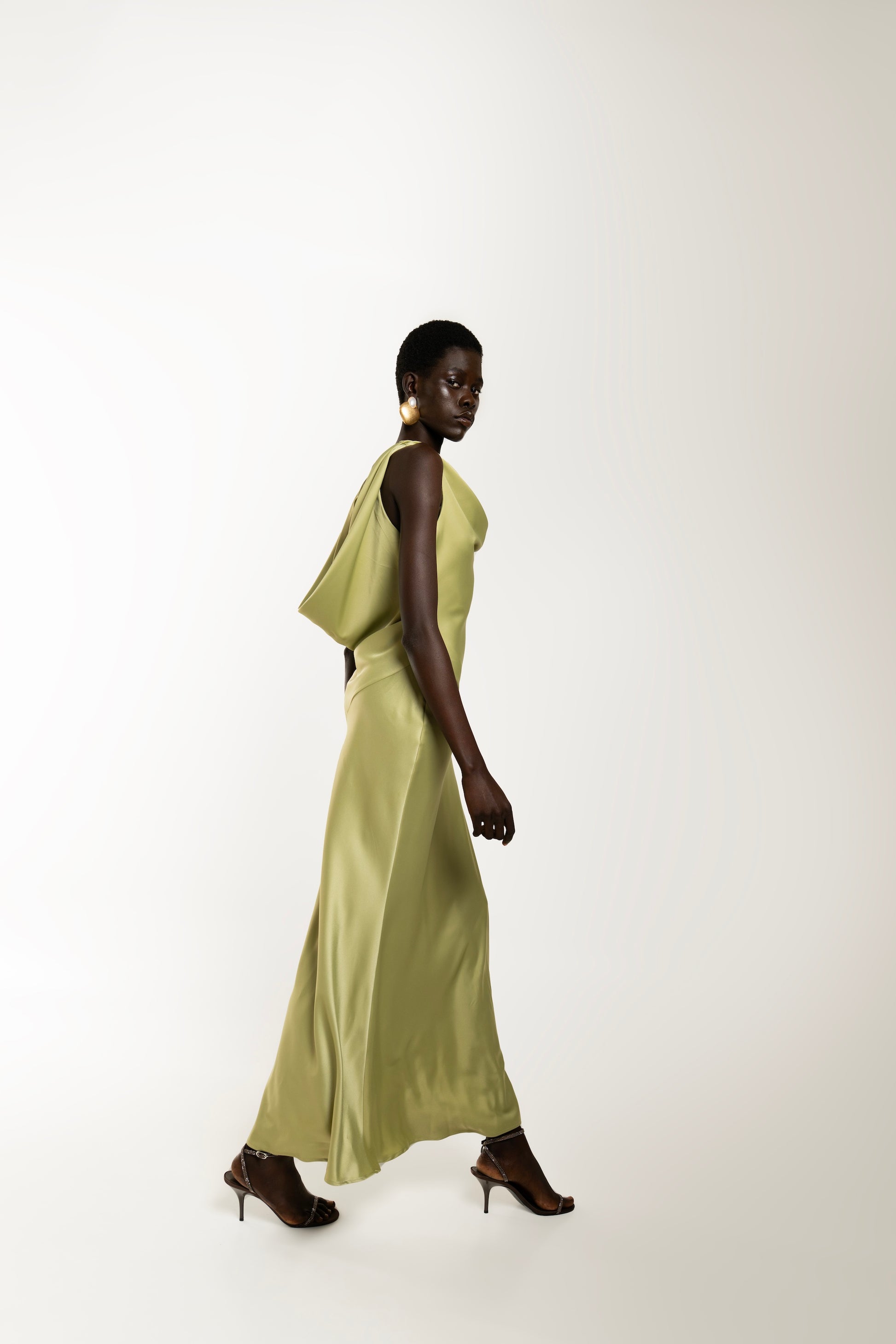 IRA by Irini Charalampous, @irathebrand online shop fashionable ready-to-wear womenswear brand KAIA satin basic maxi dress with open back and tie detail in olive green color. Shop online from Cyprus and Greece.