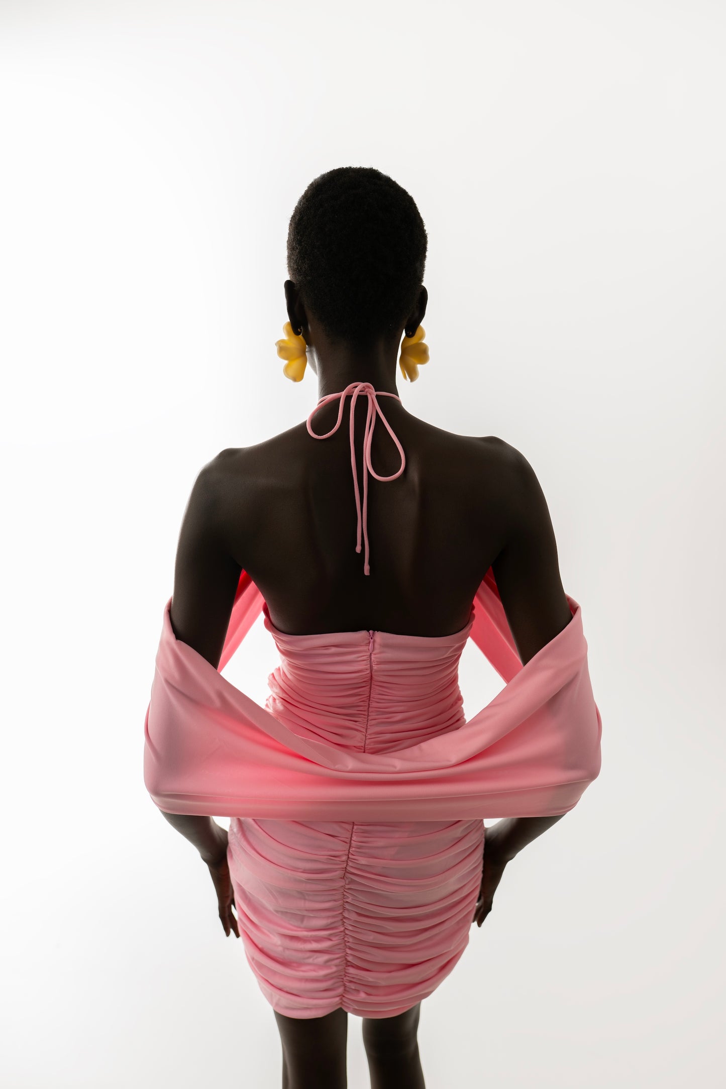 IRA by Irini Charalampous, @irathebrand online shop fashionable ready-to-wear womenswear brand AVA mini dress with ruching and rose at the neck in pink color. Shop online from Cyprus and Greece.