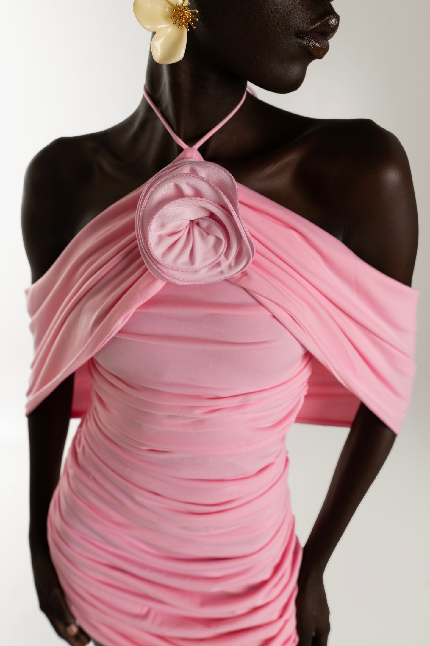 IRA by Irini Charalampous, @irathebrand online shop fashionable ready-to-wear womenswear brand AVA mini dress with ruching and rose at the neck in pink color. Shop online from Cyprus and Greece.