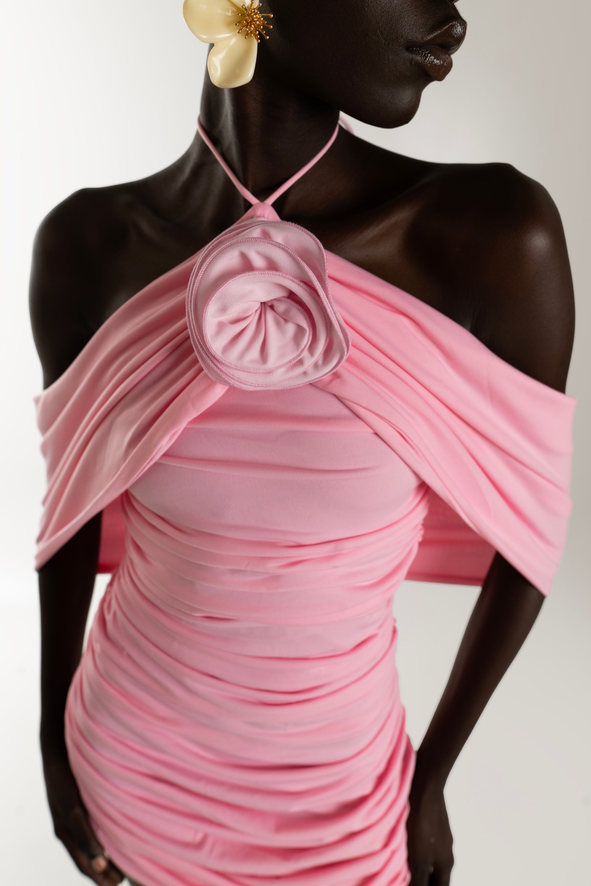 IRA by Irini Charalampous, @irathebrand online shop fashionable ready-to-wear womenswear brand AVA mini dress with ruching and rose at the neck in pink color. Shop online from Cyprus and Greece.